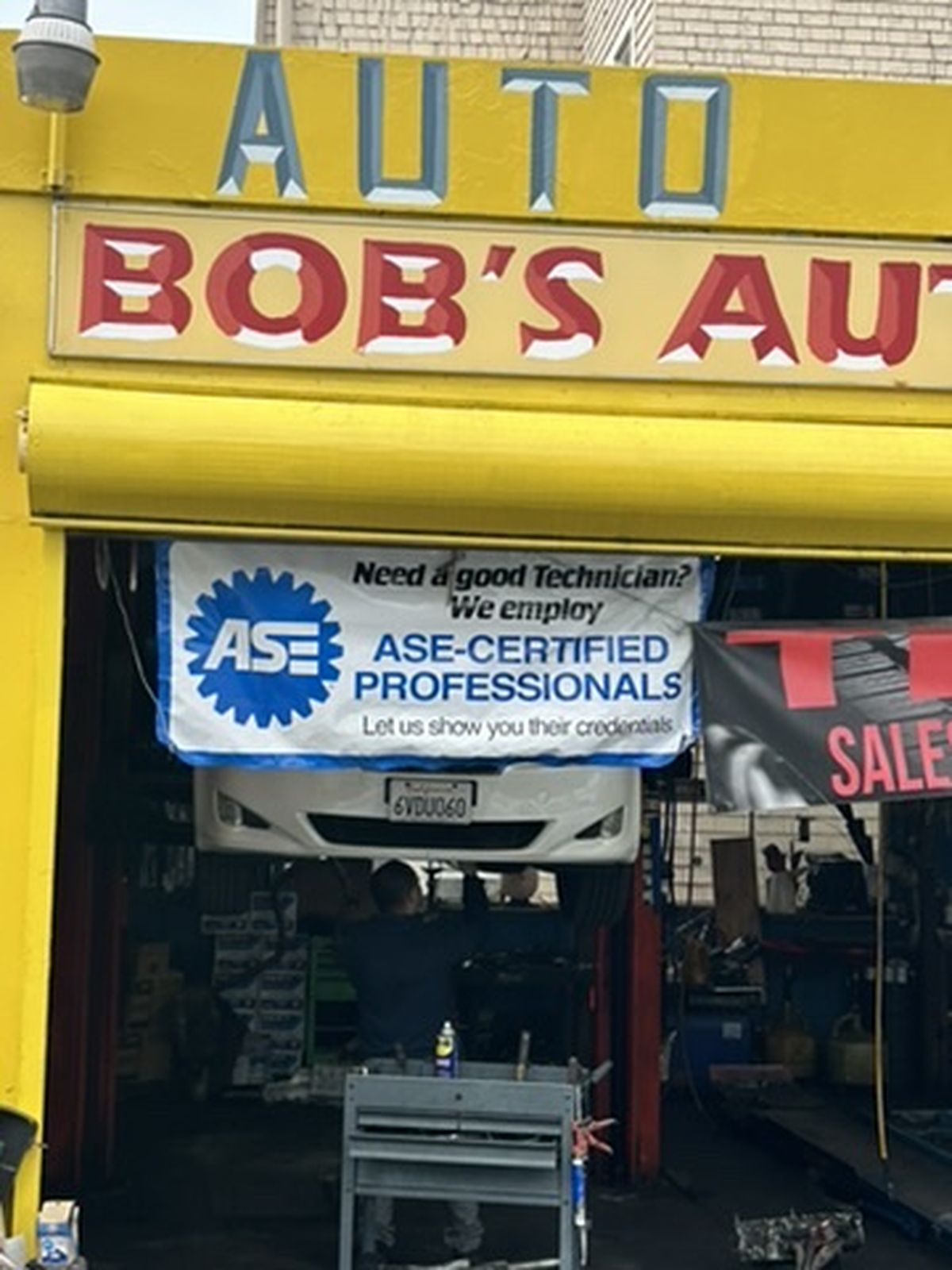 ASE-certified professionals banner at the shop